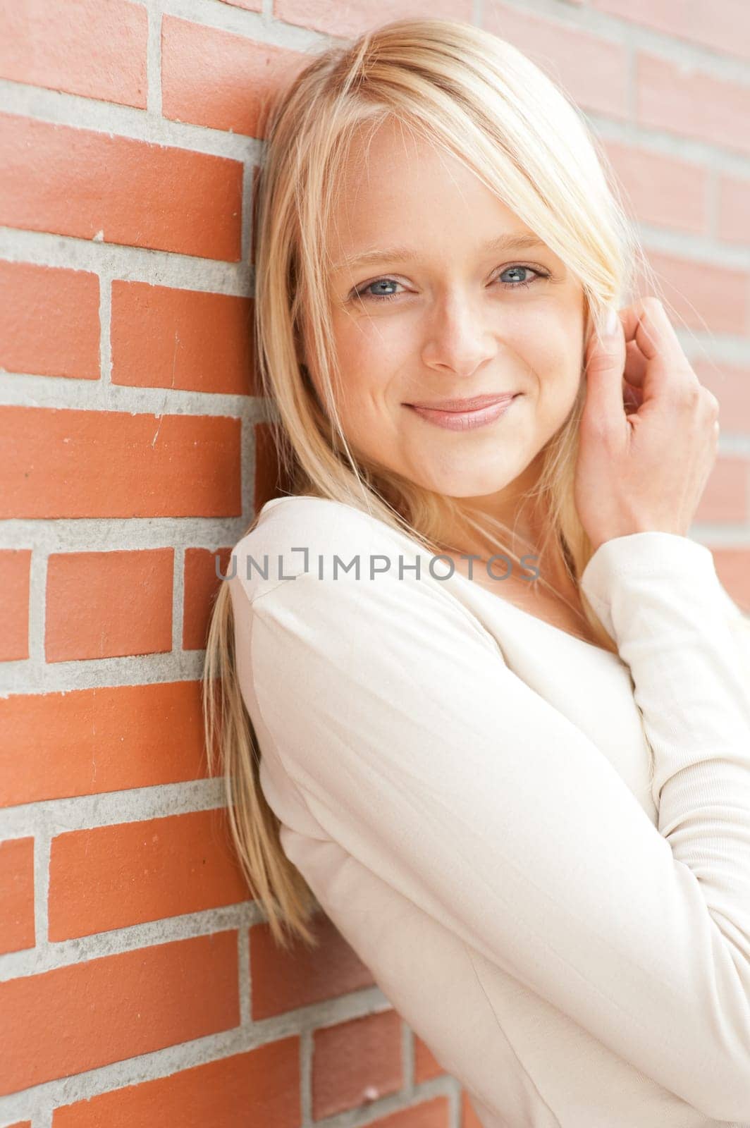 Portrait of a young and smiling woman in the park