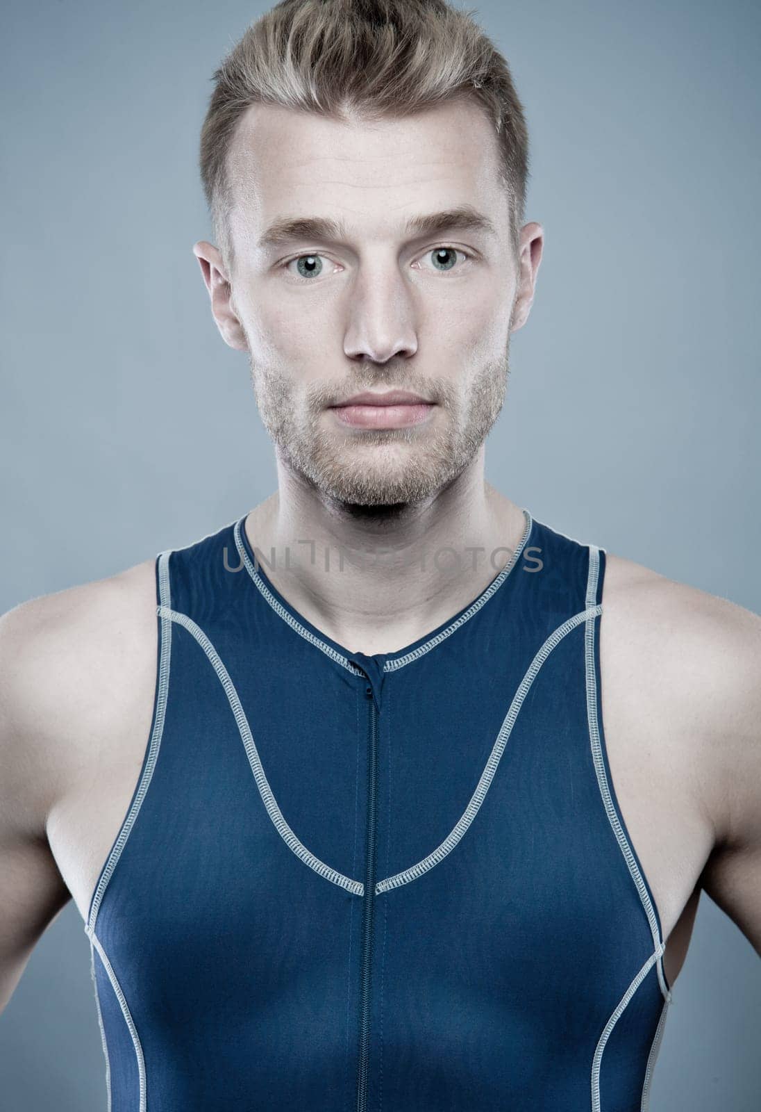 Portrait of a sportsman against a blue background