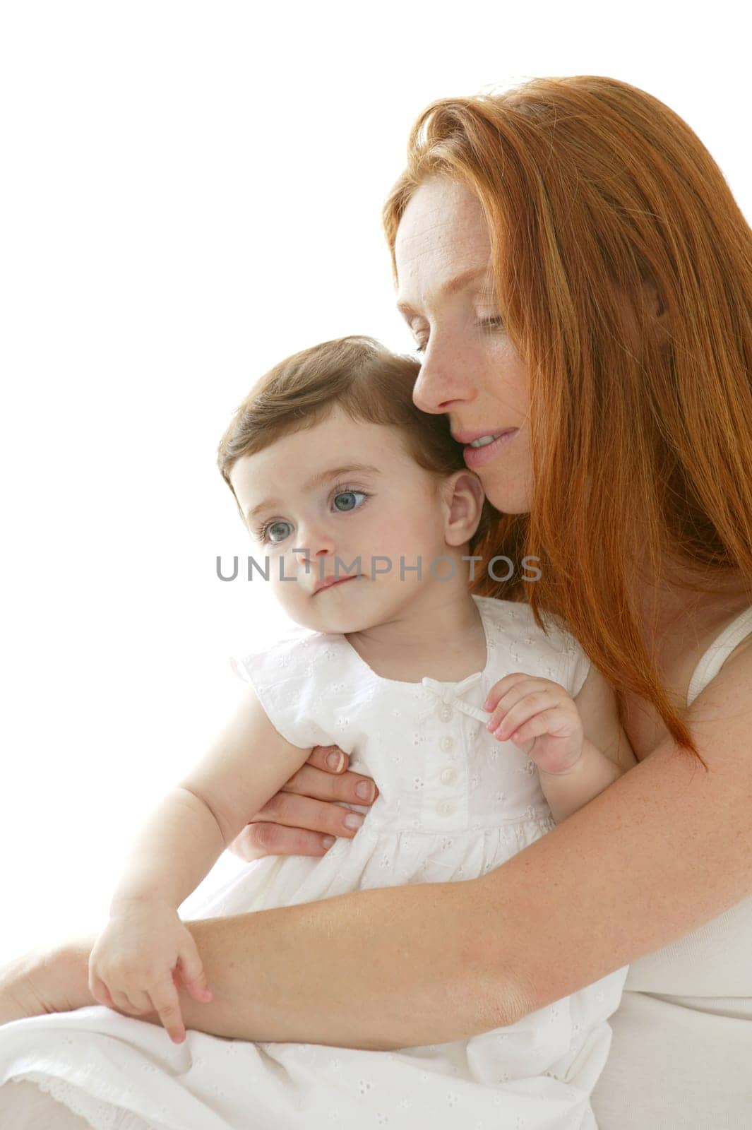 baby brunette and redhead mother love hug on white