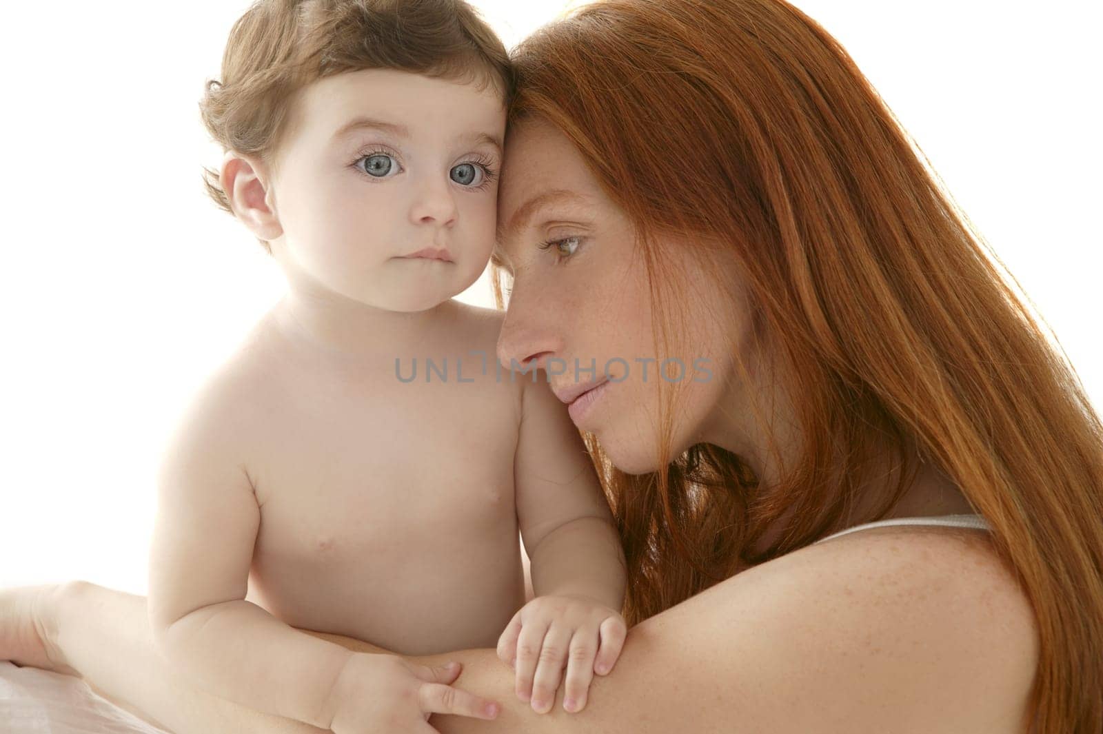 nude baby and mother portrait hug playing white background