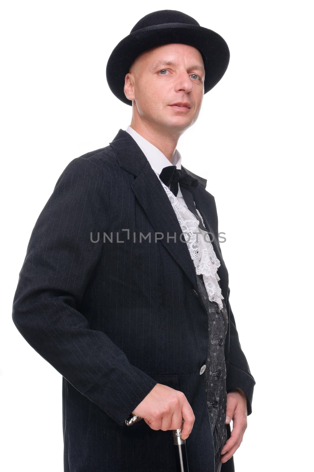 Man in western outfit against white background in studio