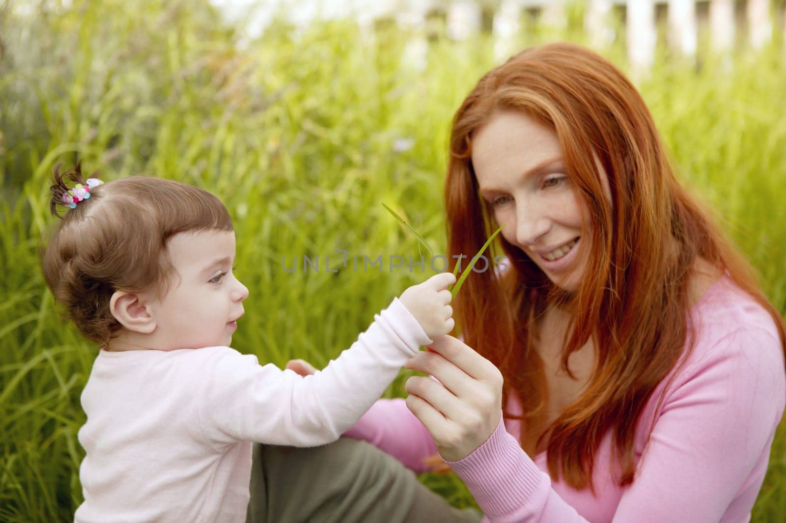 beautiful mother and baby little girl outdoor park garden grass playing