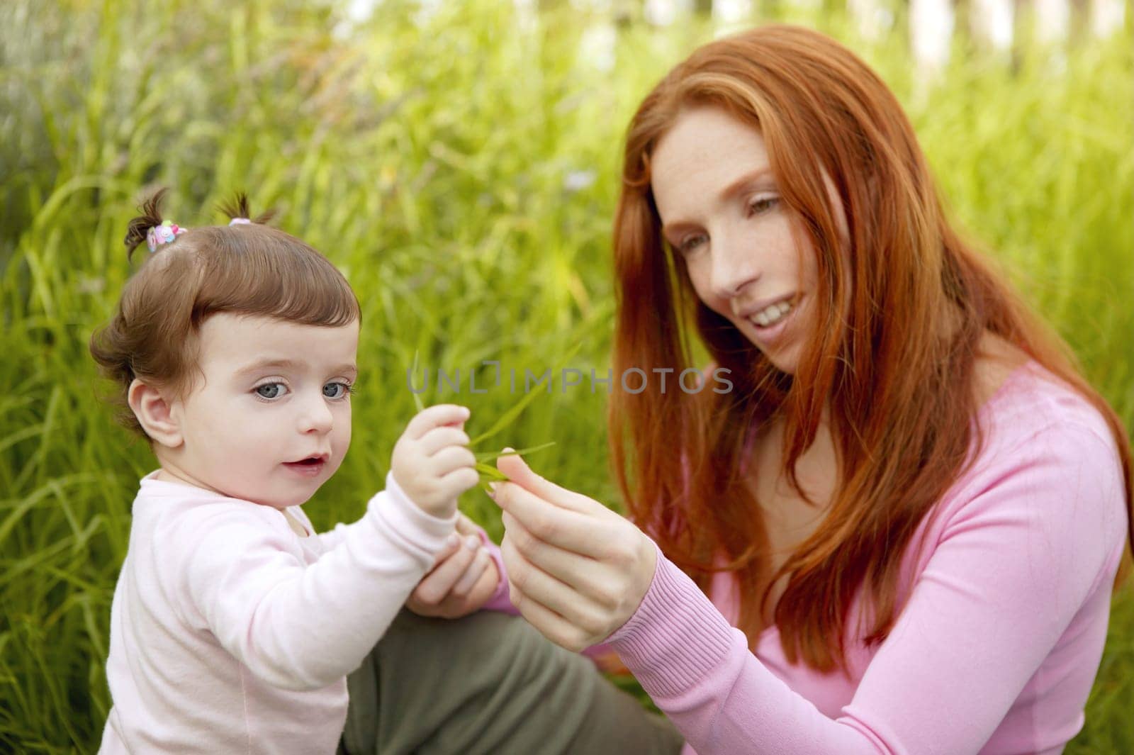 beautiful mother and baby little girl outdoor park garden grass playing