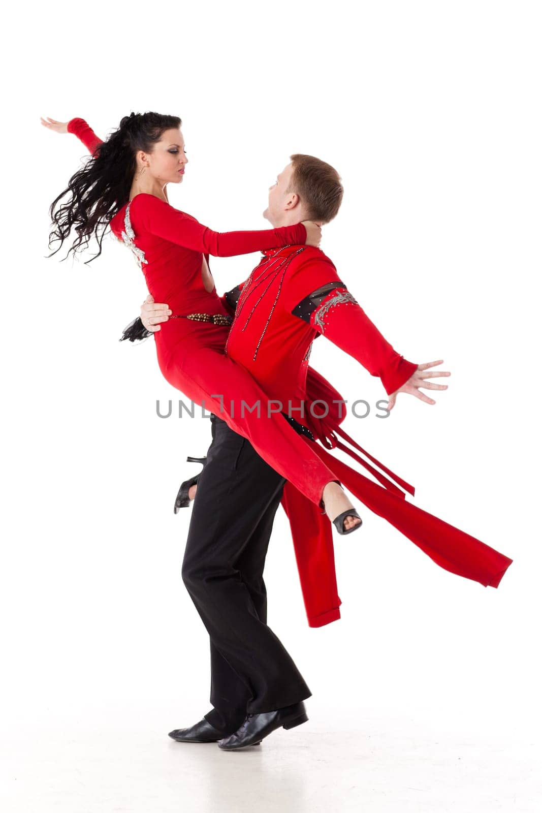 Dancing young couple on a white background.