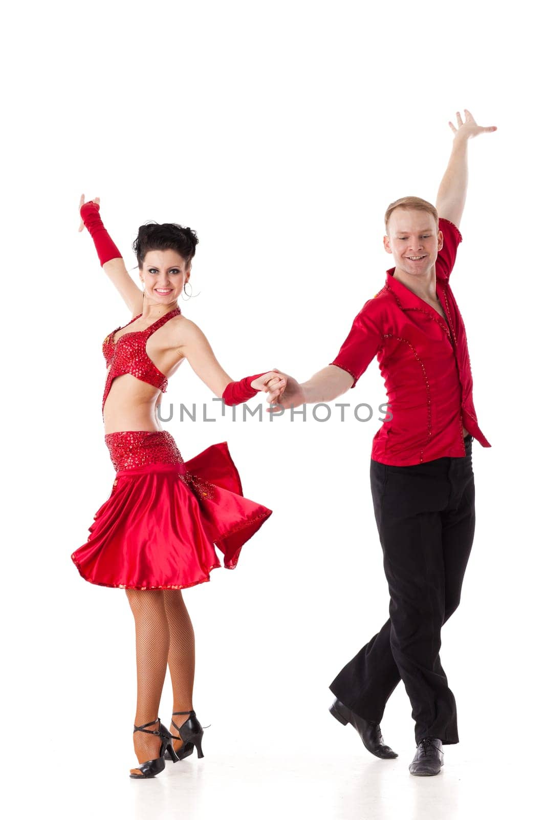 Dancing young couple on a white background.