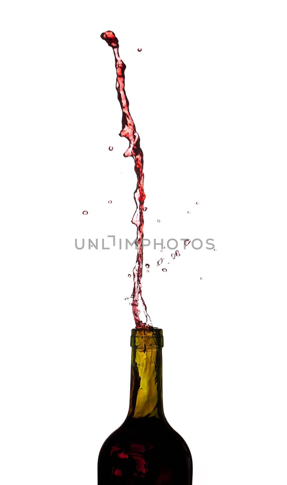 Red wine being poured directly upwards from bottle