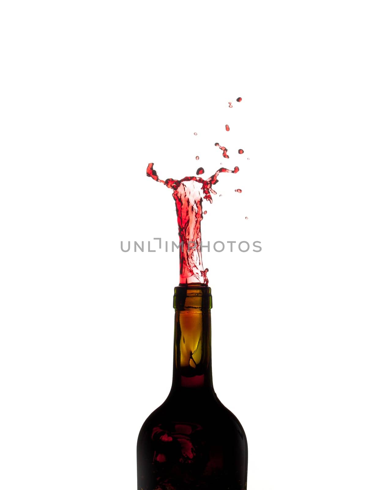 Red wine being poured directly upwards from bottle