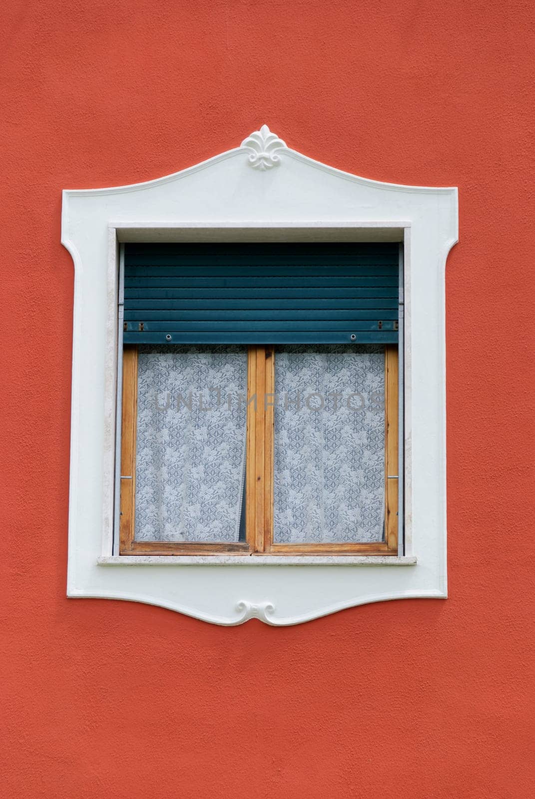 window decoration and orange wall