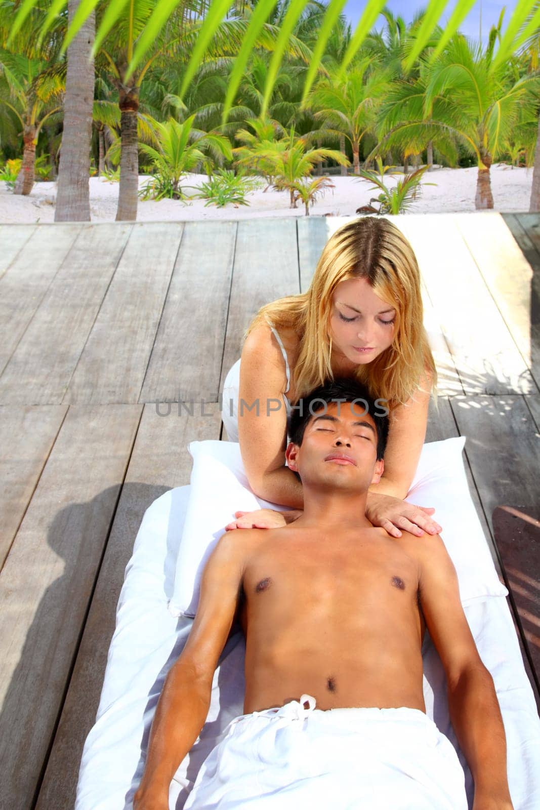 massage therapy stretch head neck outdoor palm trees tropical beach