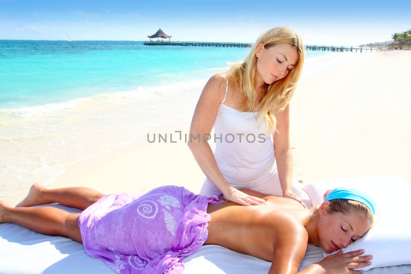 Caribbean turquoise beach chiropractic massage therapy woman
