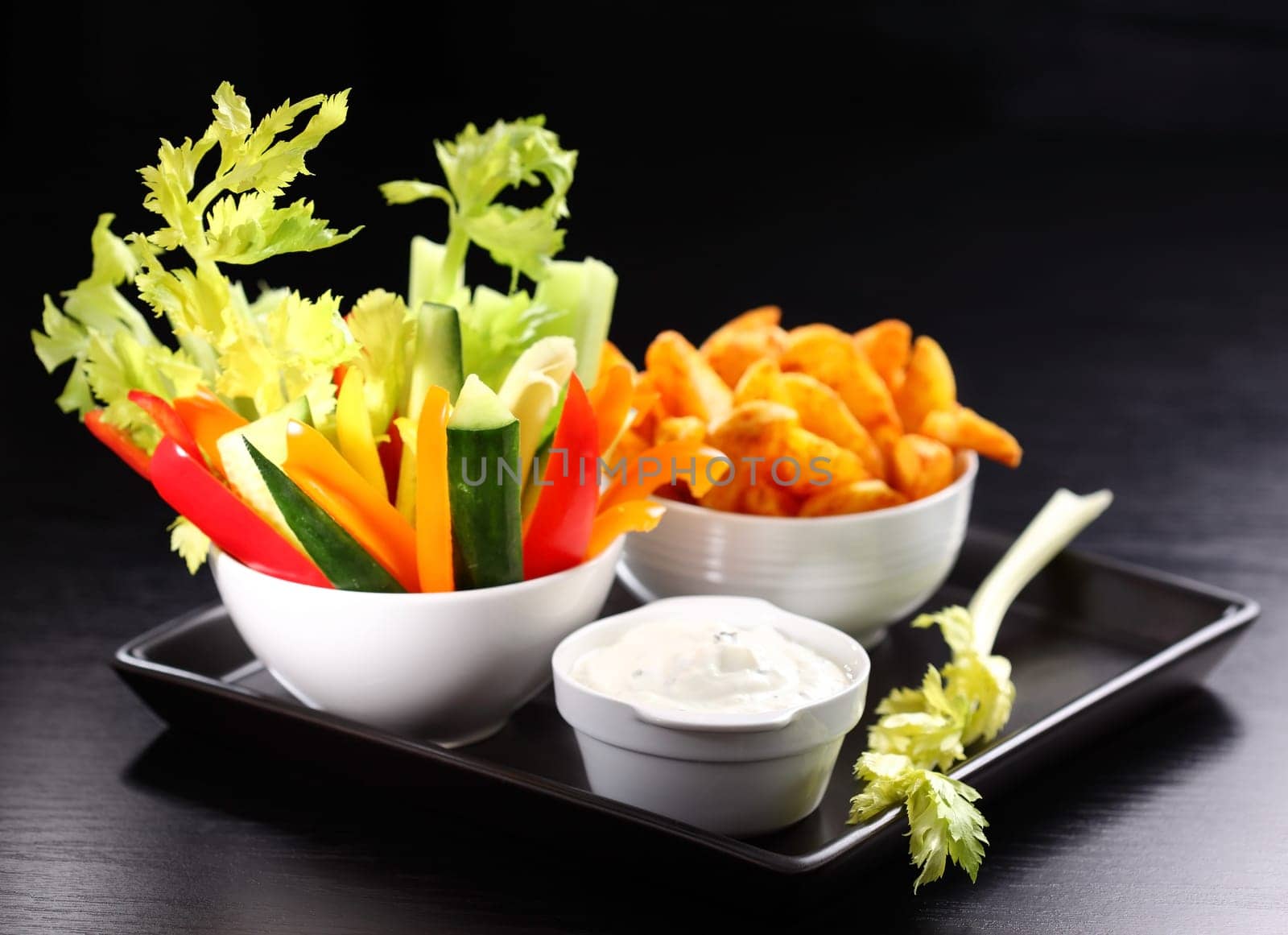 Raw vegetable and wedges with cream cheese dip