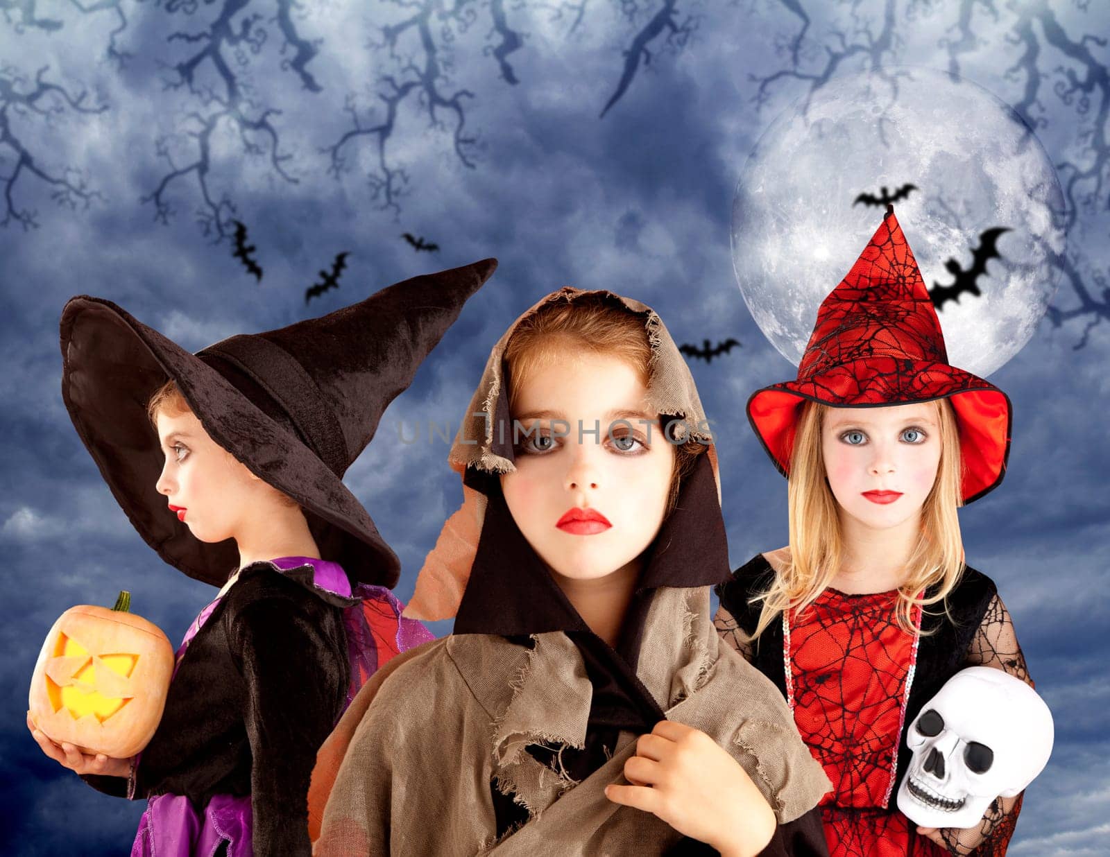 Halloween kid girls and pumpkin on cloudy moon sky