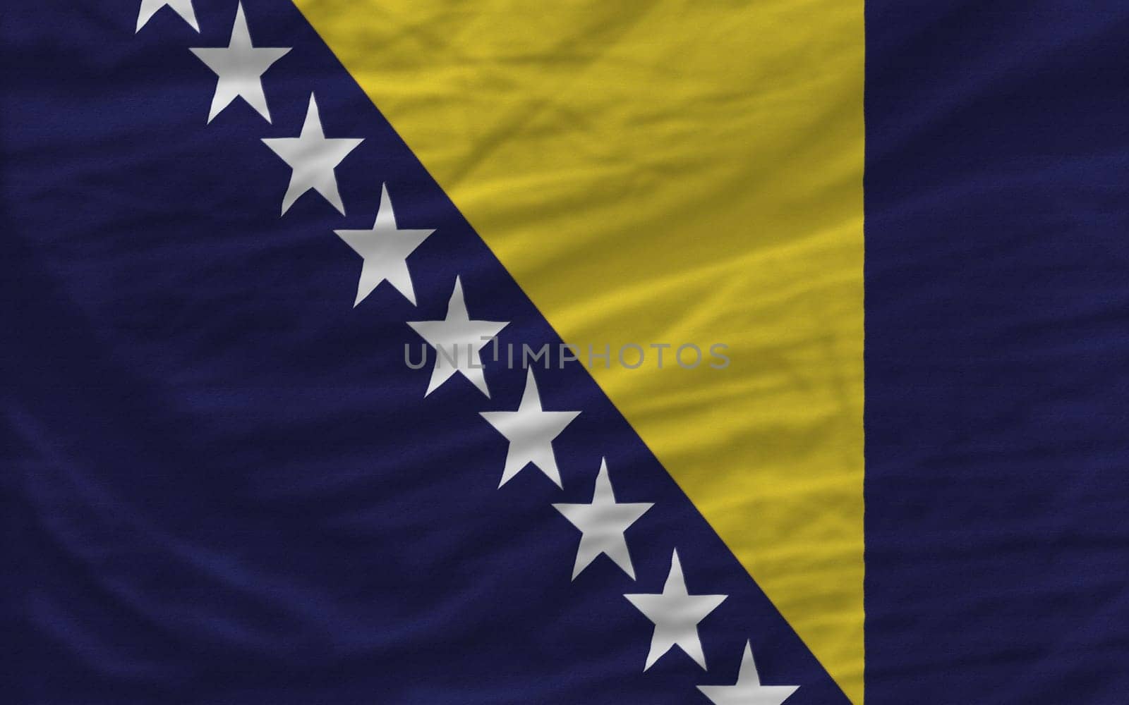 complete national flag of bosnia herzegovina covers whole frame, waved, crunched and very natural looking. It is perfect for background