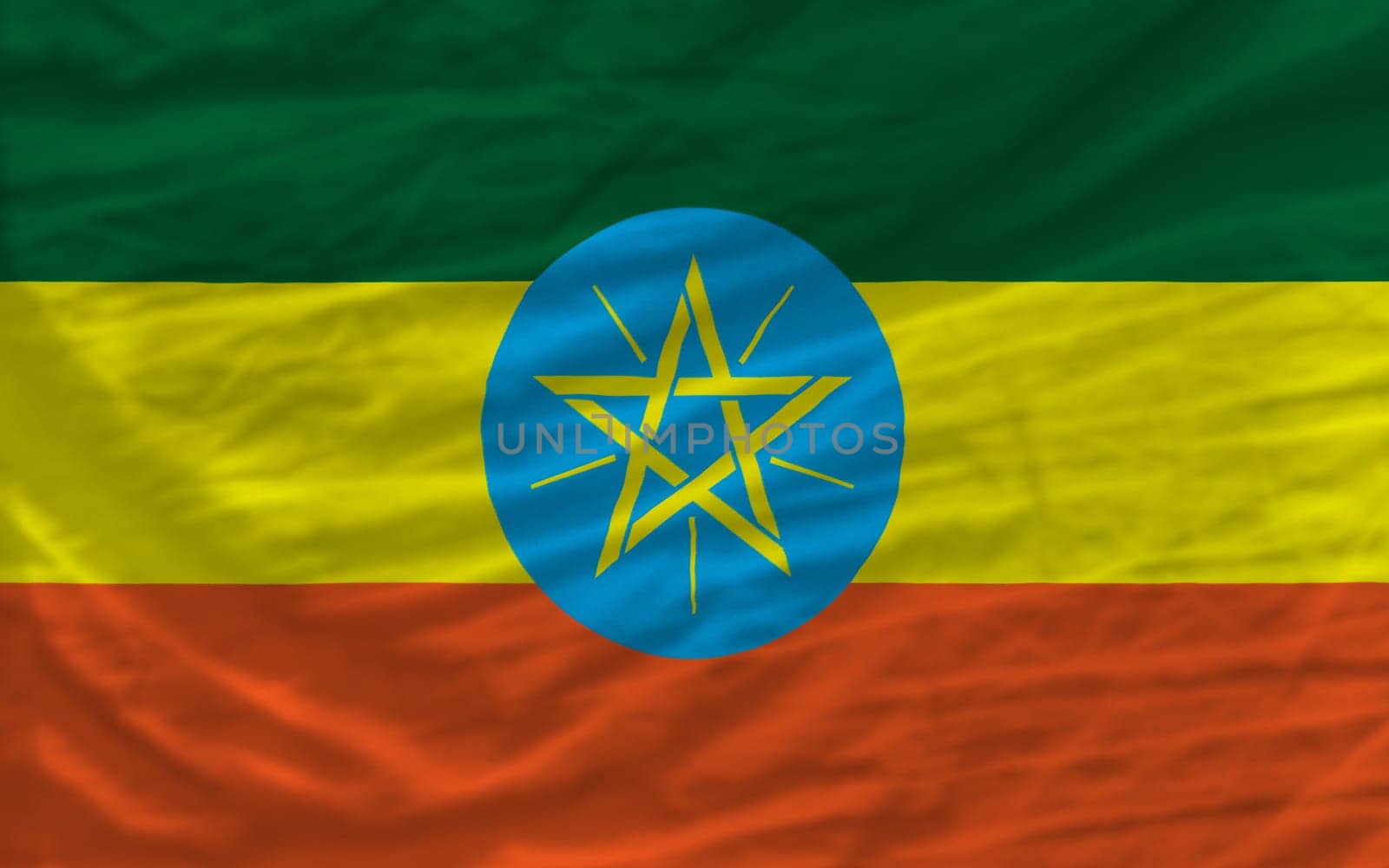 complete national flag of ethiopia covers whole frame, waved, crunched and very natural looking. It is perfect for background