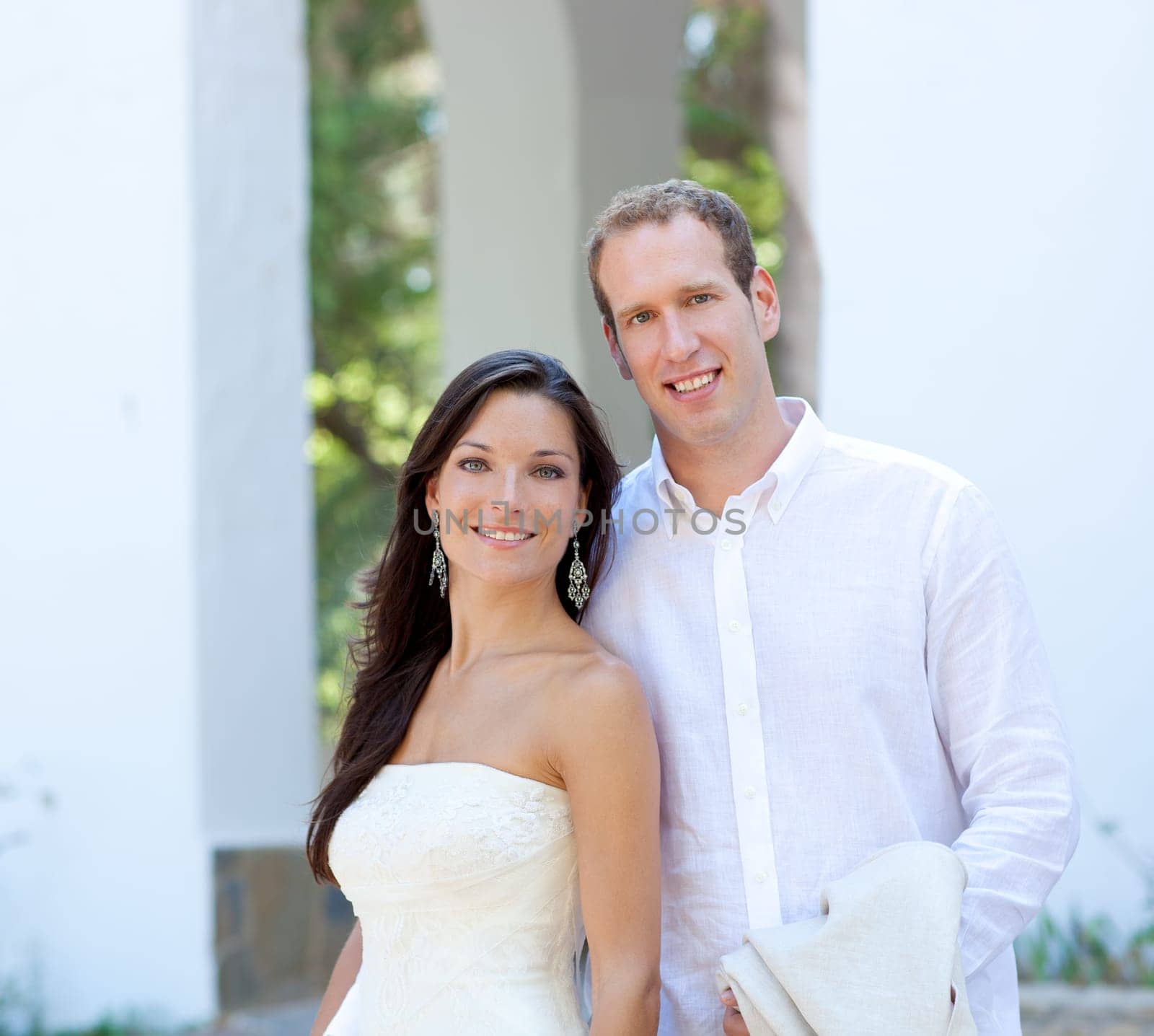 bride couple just married in mediterranean arches