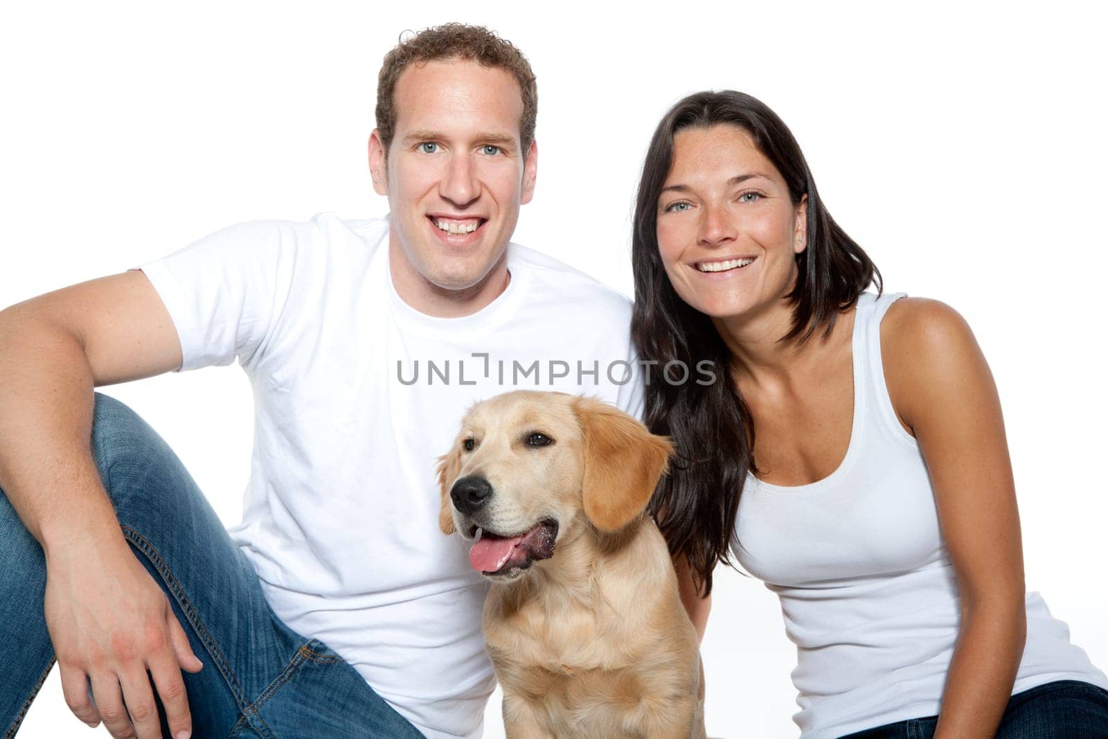 couple in love with puppy dog golden retriever isolated on white