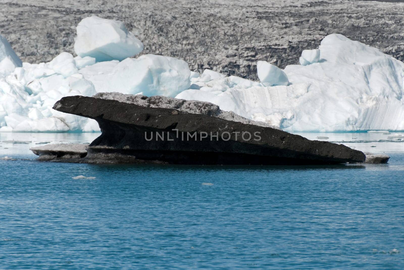 dirty icebergs  of lava floating on the Jokulsarlon lake in Iceland