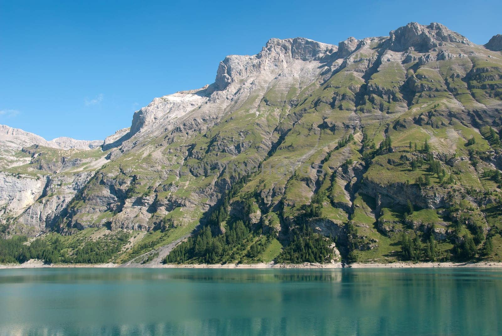 mountains reflected on the Tseuzier lake in Switzerland