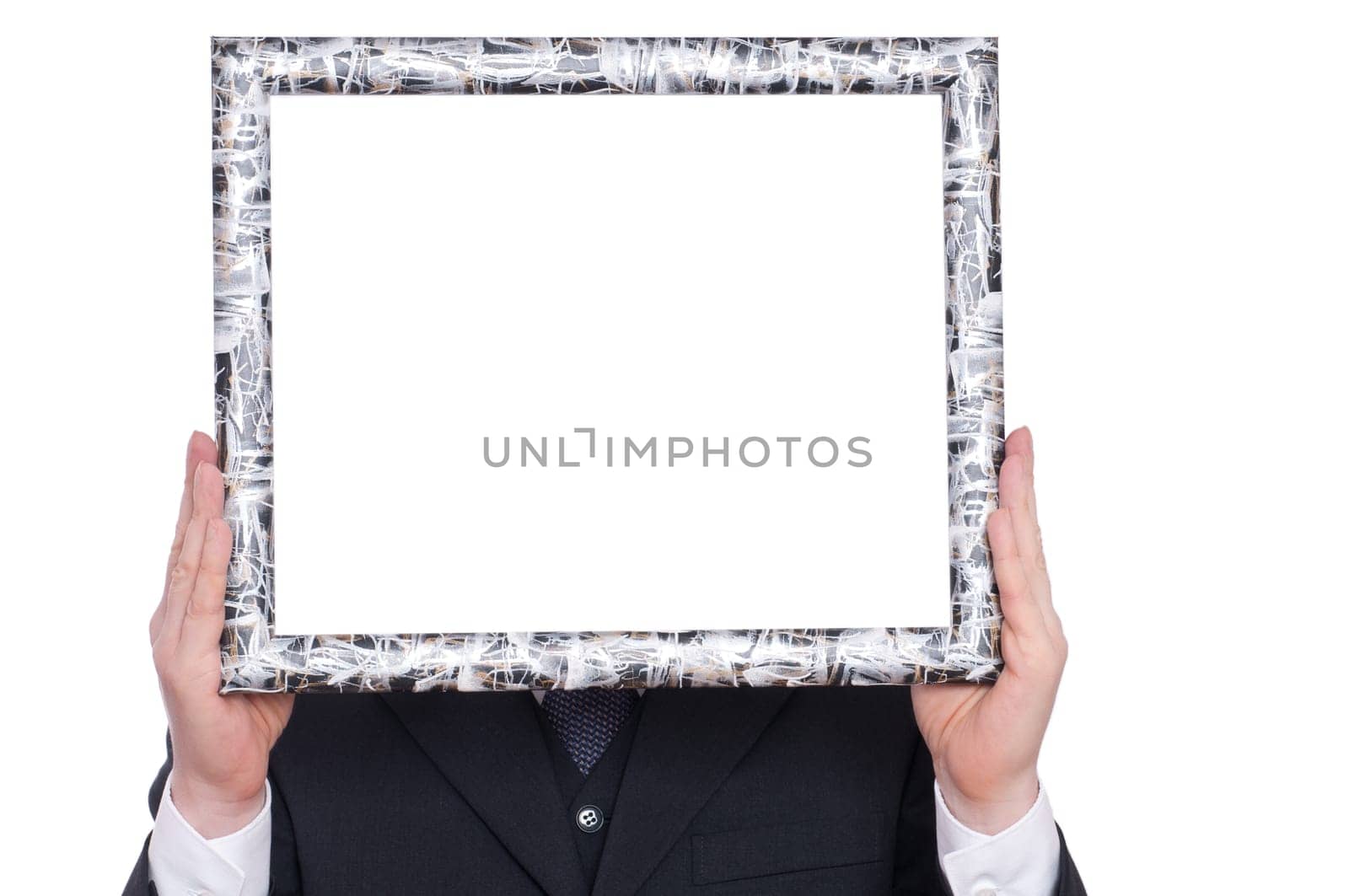 A wooden frame is held by two hands