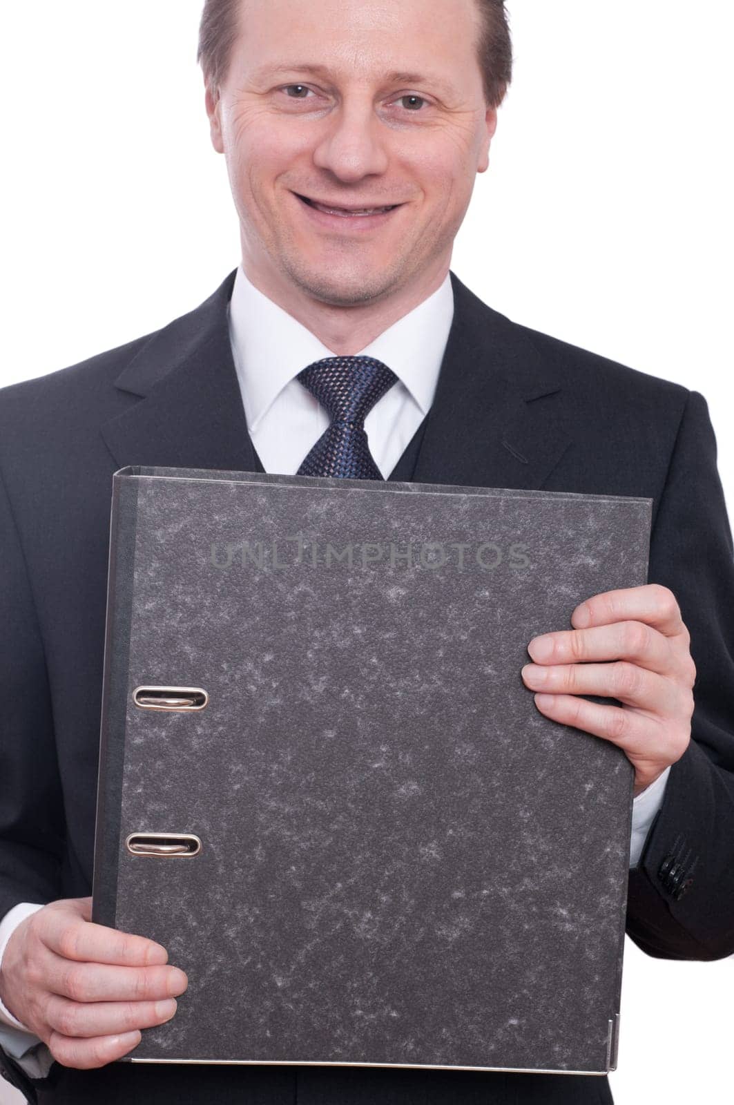 A man in a tie and suit holds a folder in his hands