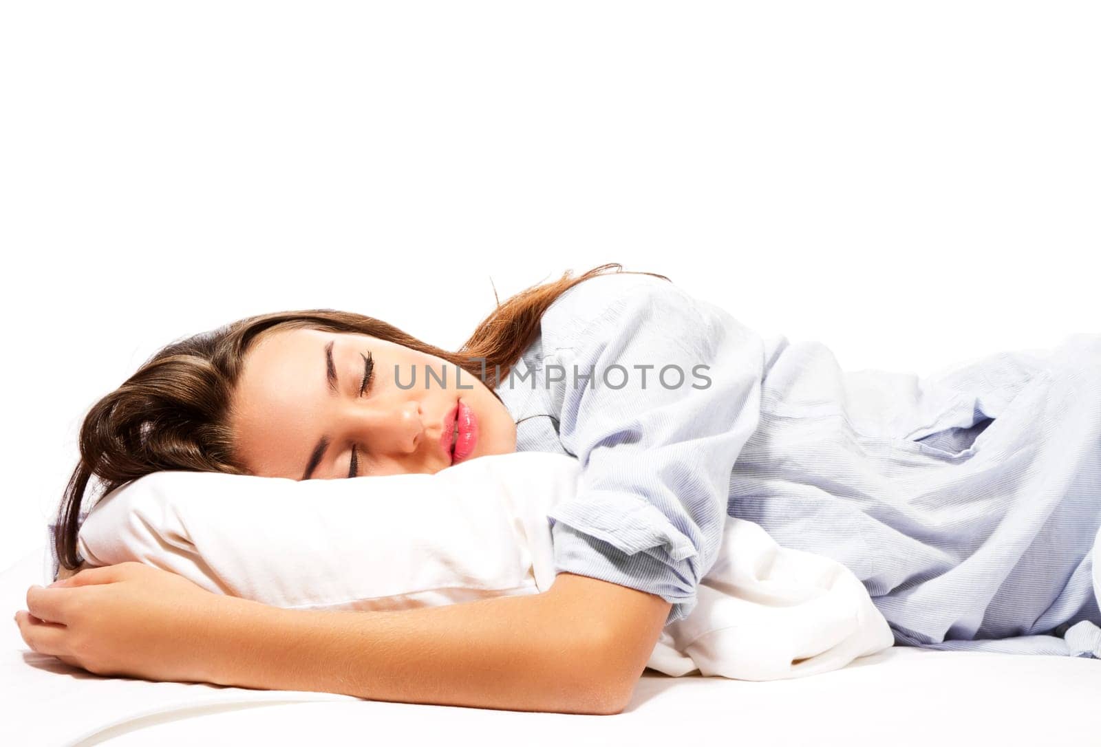 Sleeping beautiful woman in pajamas against white background