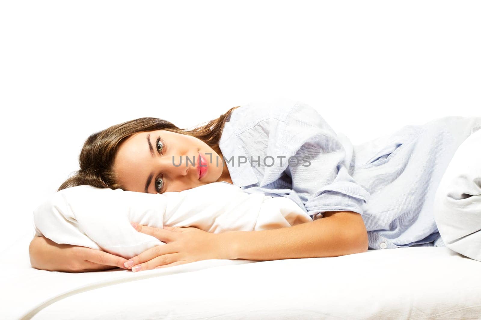 Beautiful woman waking up against white background