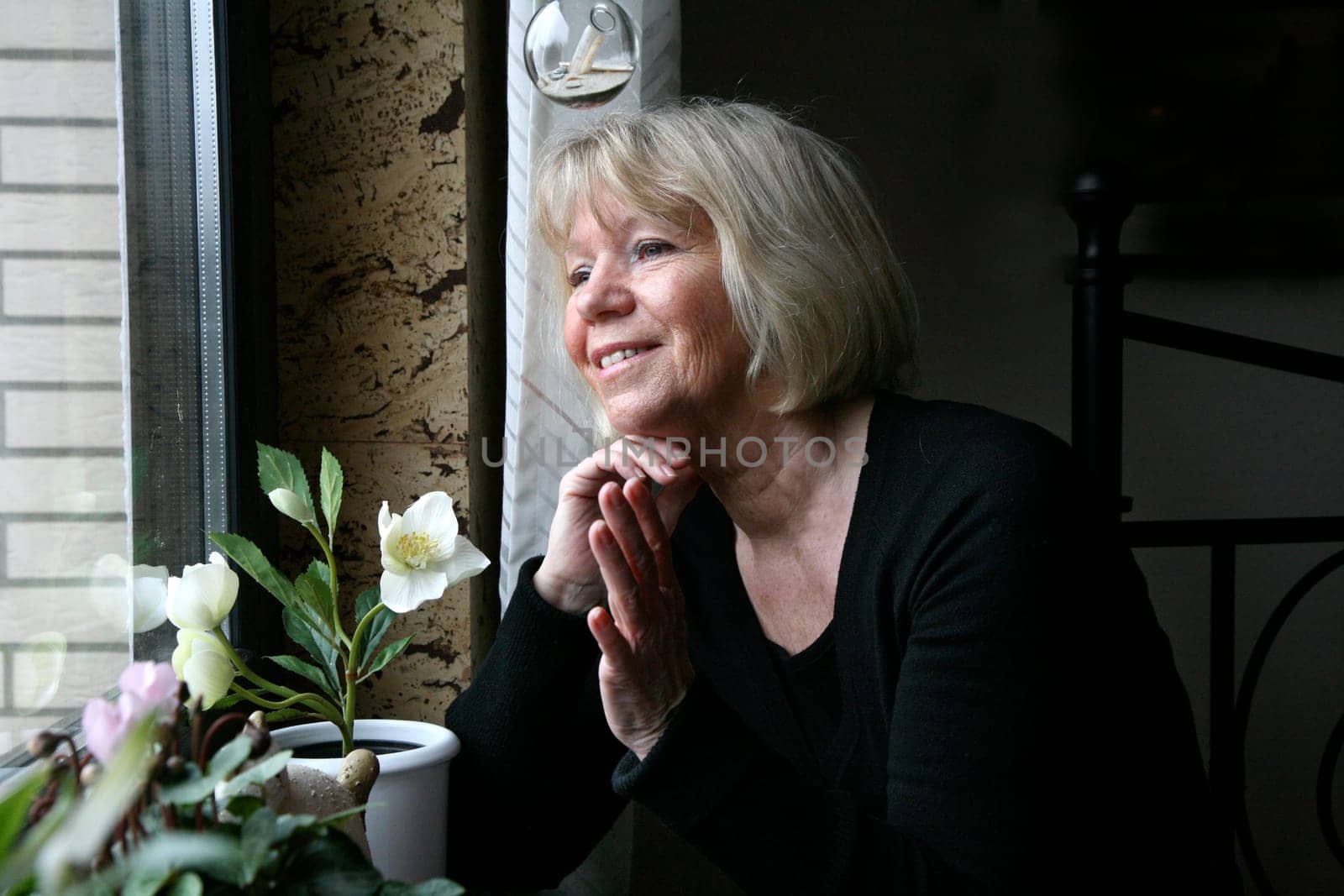 Senior woman at the window