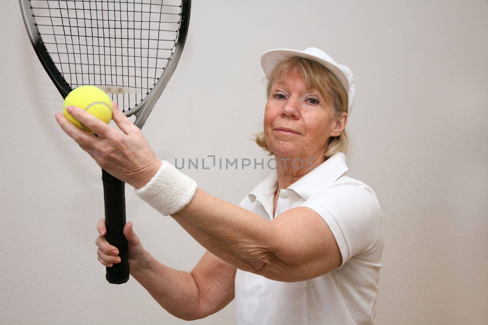 Senior woman playing tennis