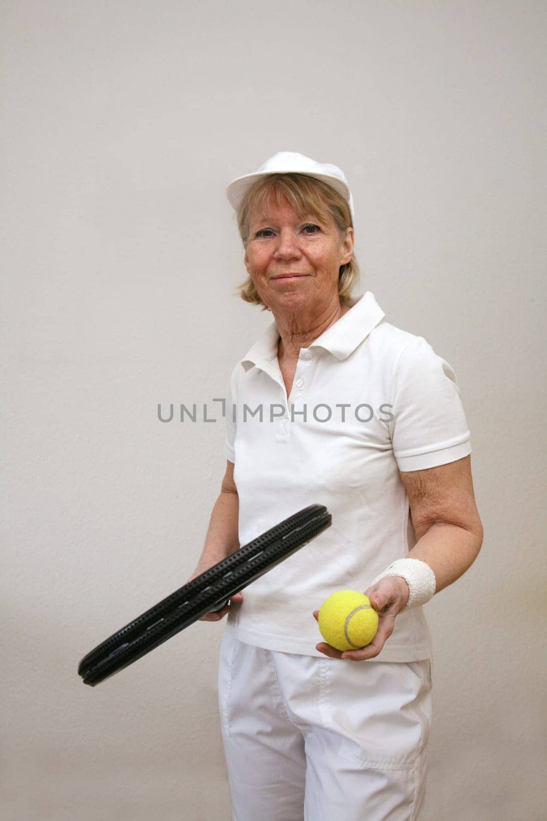 Senior woman playing tennis