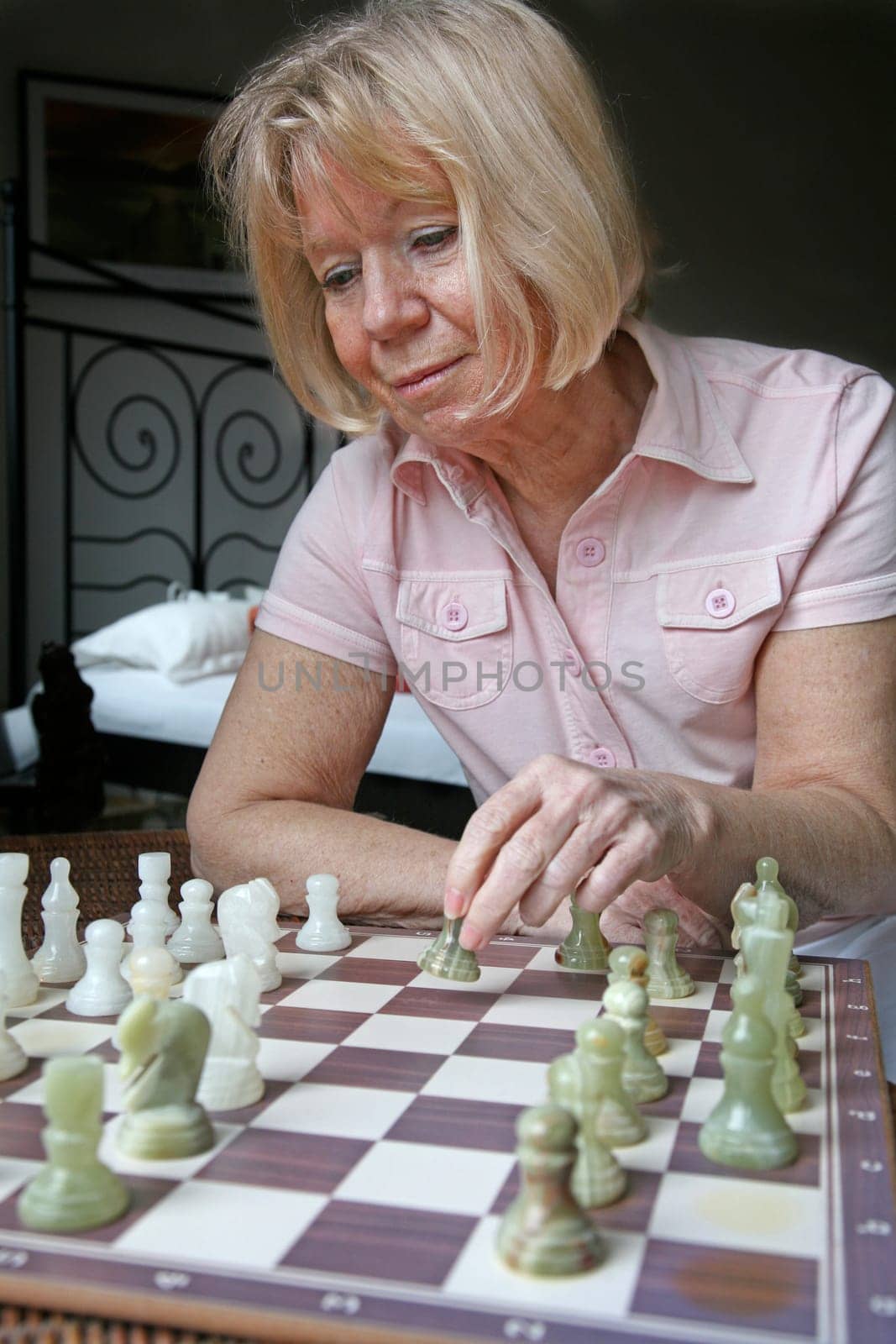 Senior woman playing chess