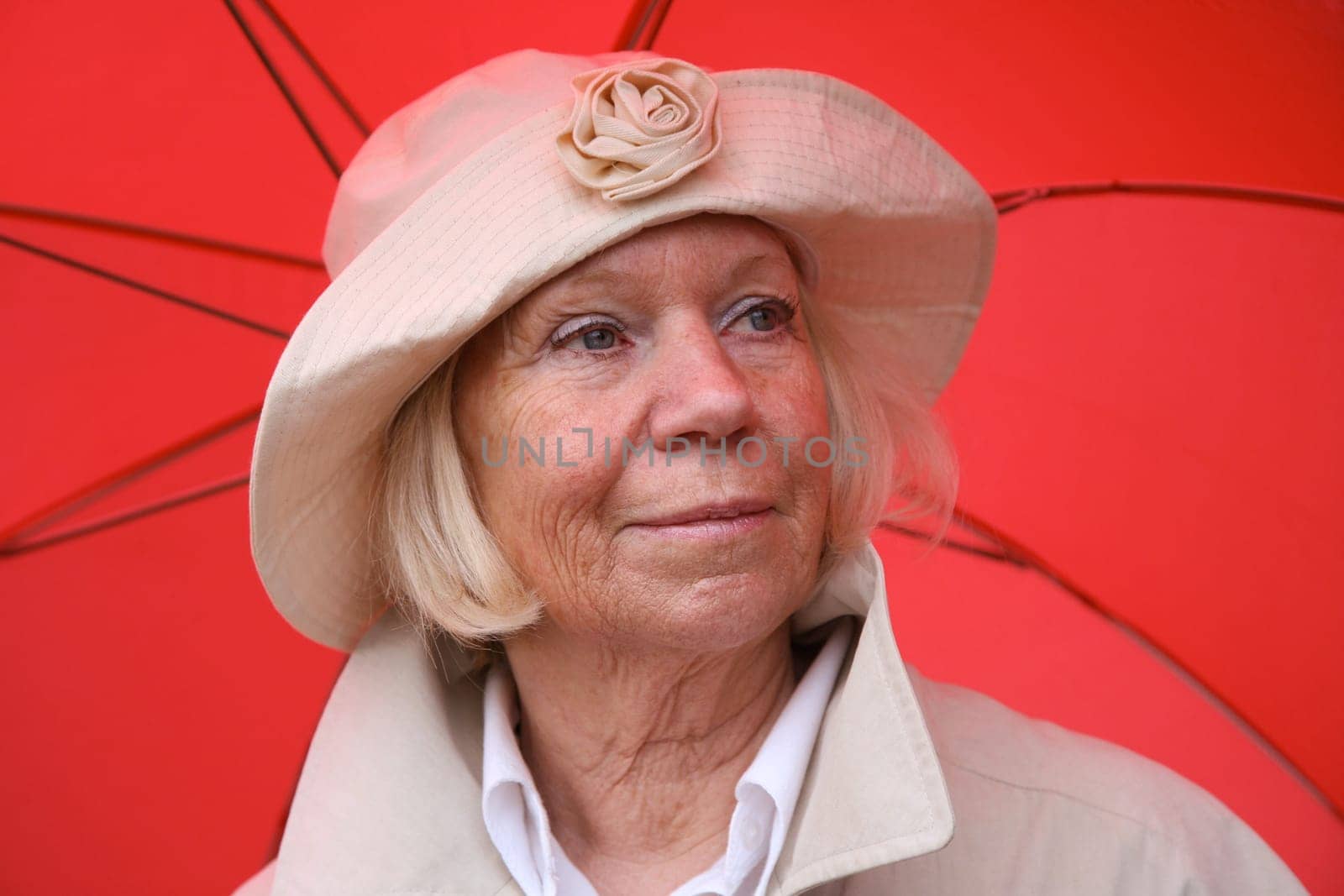Senior woman with umbrella