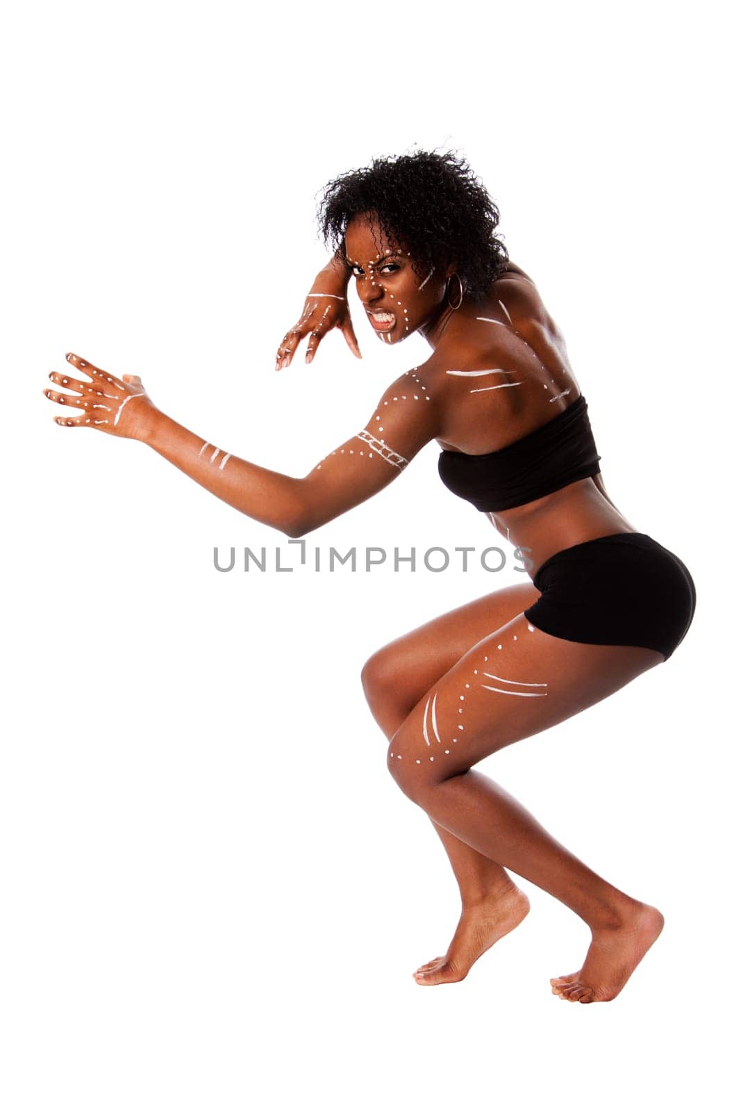 Beautiful African indigenous tribal fashion female warrior with white dots and stripes and aggressive expression, isolated.