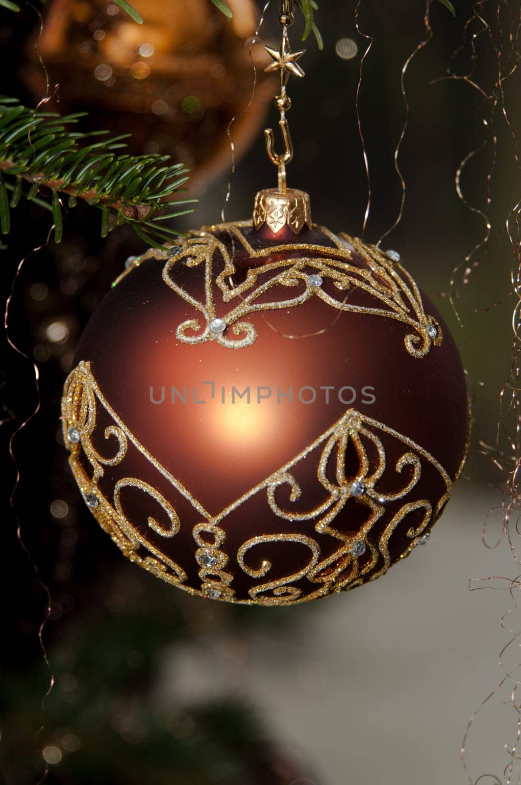 Decorative Christmas balls hanging on pine - tree branch