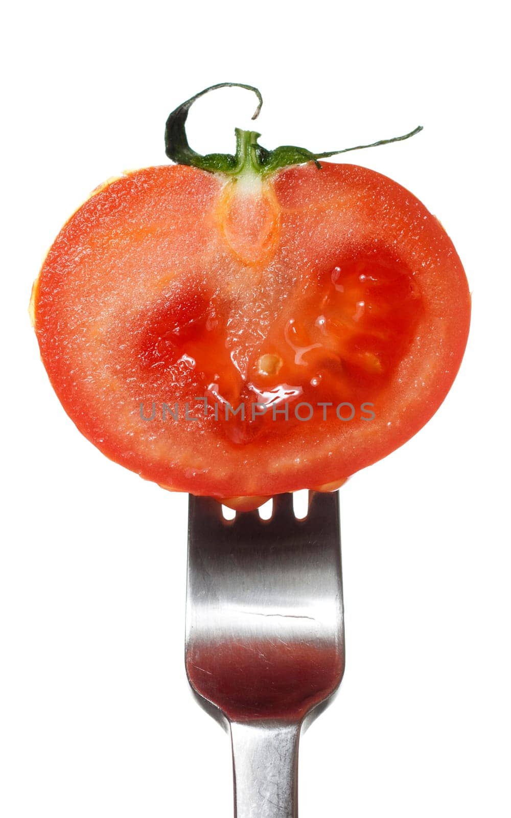 fresh red tomato on a fork