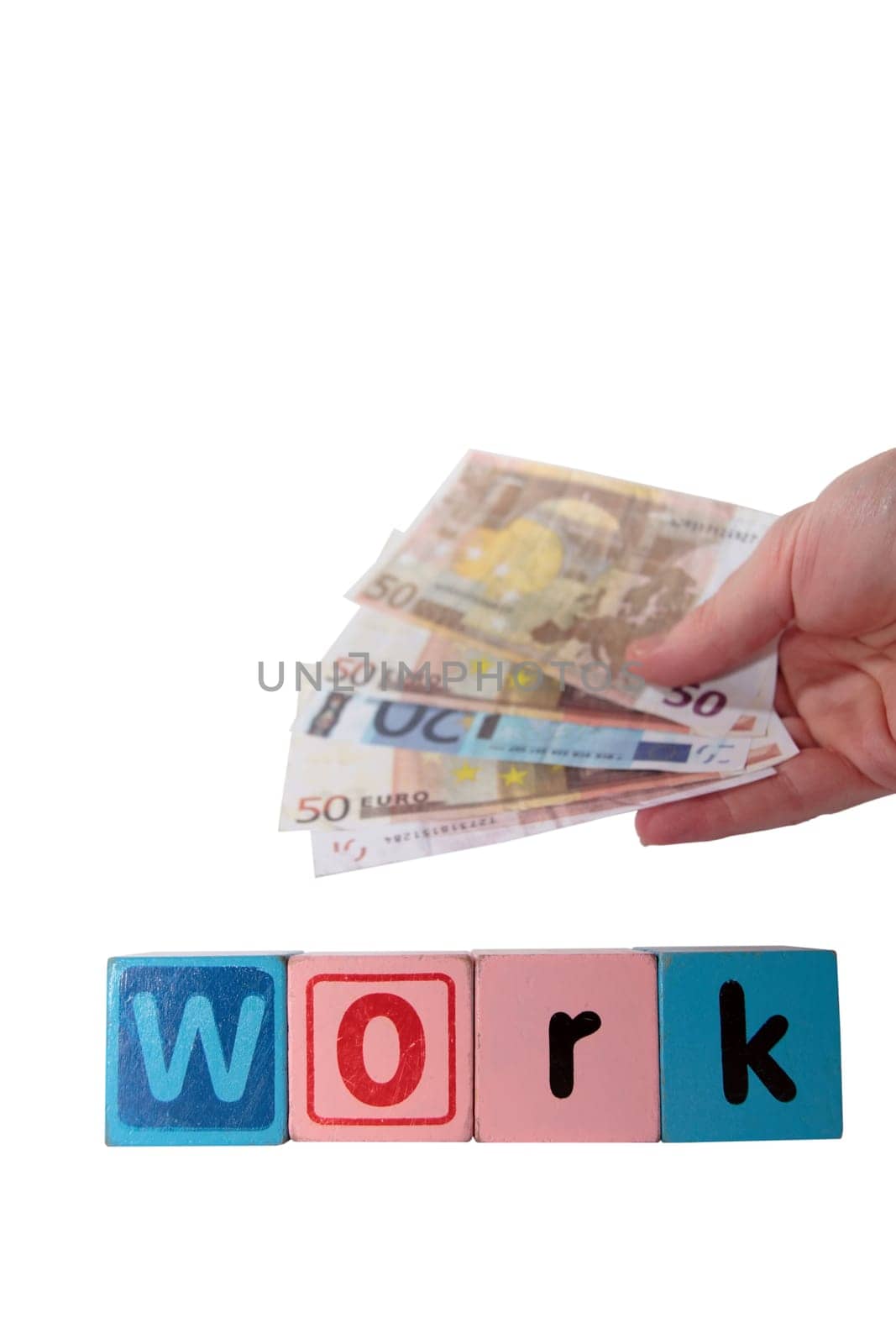 toy letters that spell work held with cash in hand against a white background with clipping path
