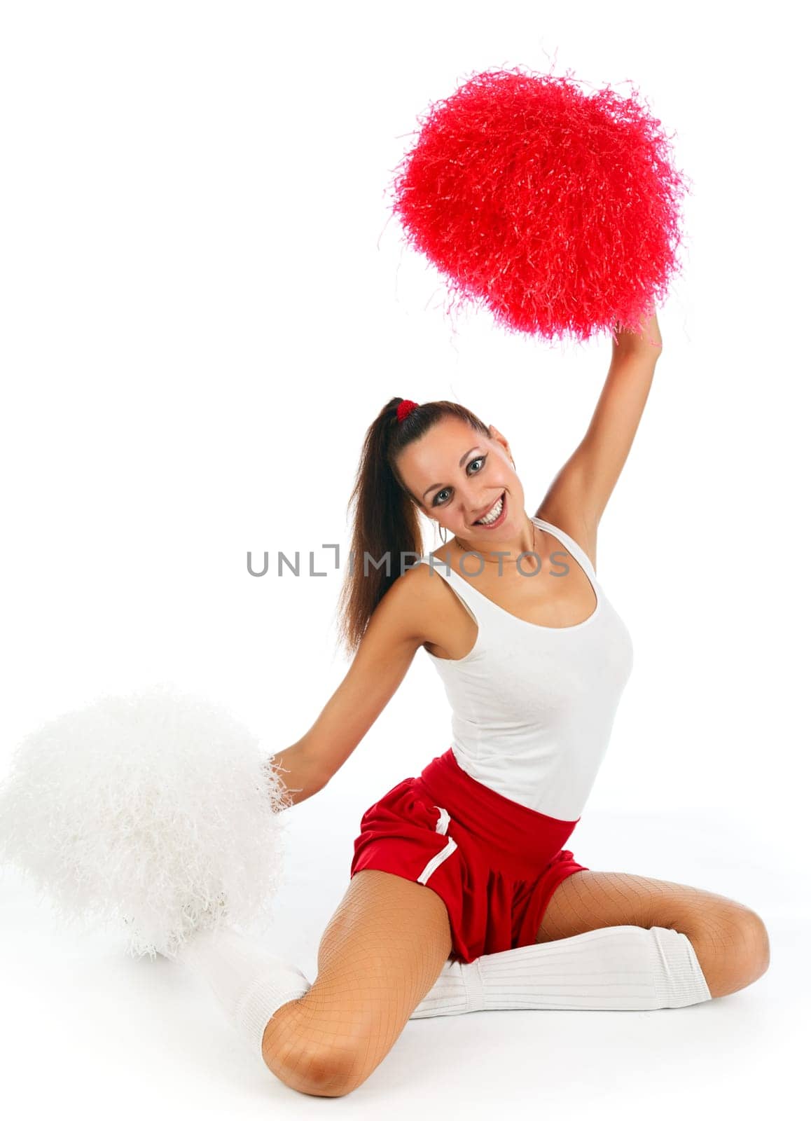 Young lady cheerleader posing in the studio, isolated on white