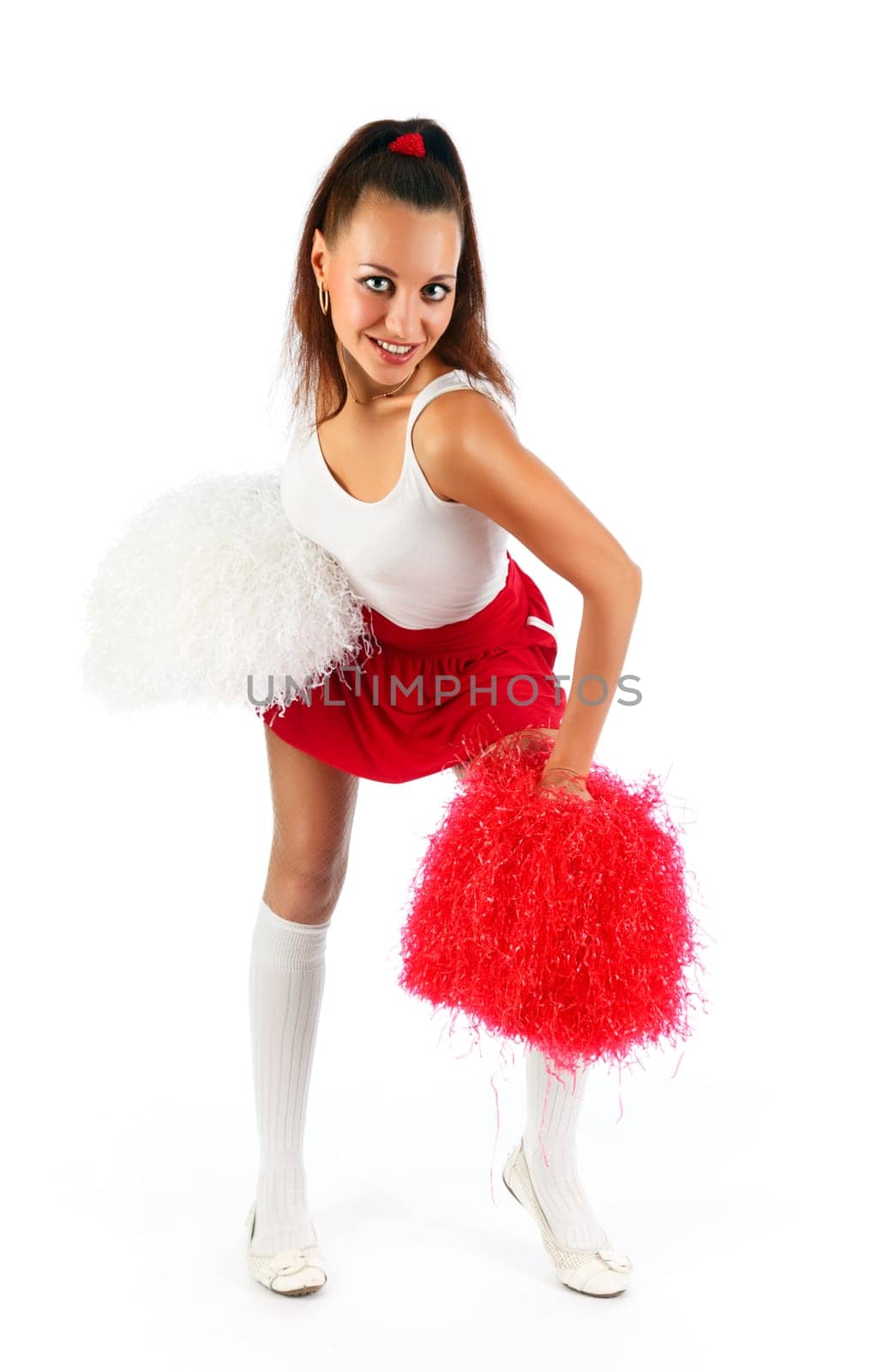 Young lady cheerleader posing in the studio, isolated on white