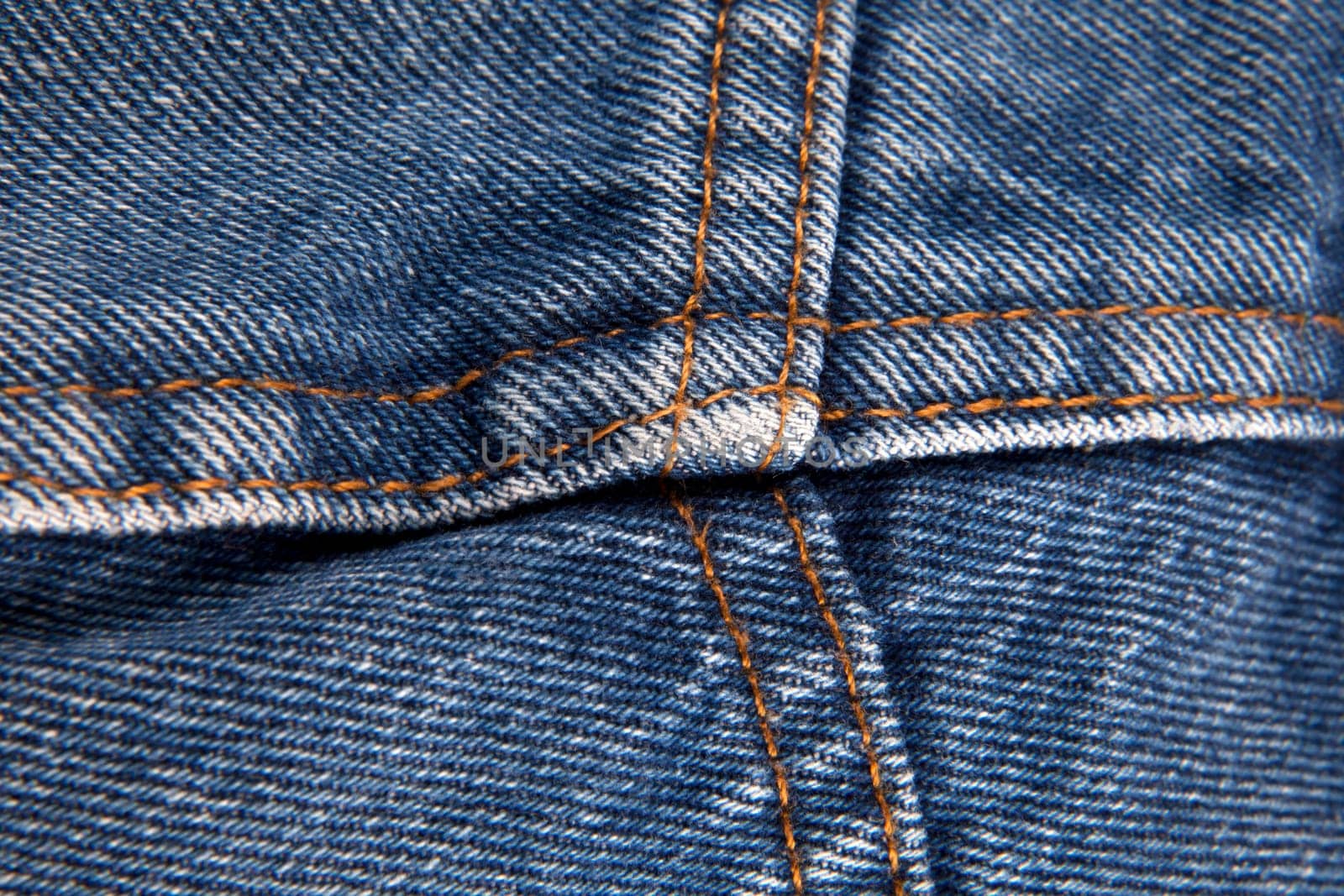 Blue jeans with yellow stitches