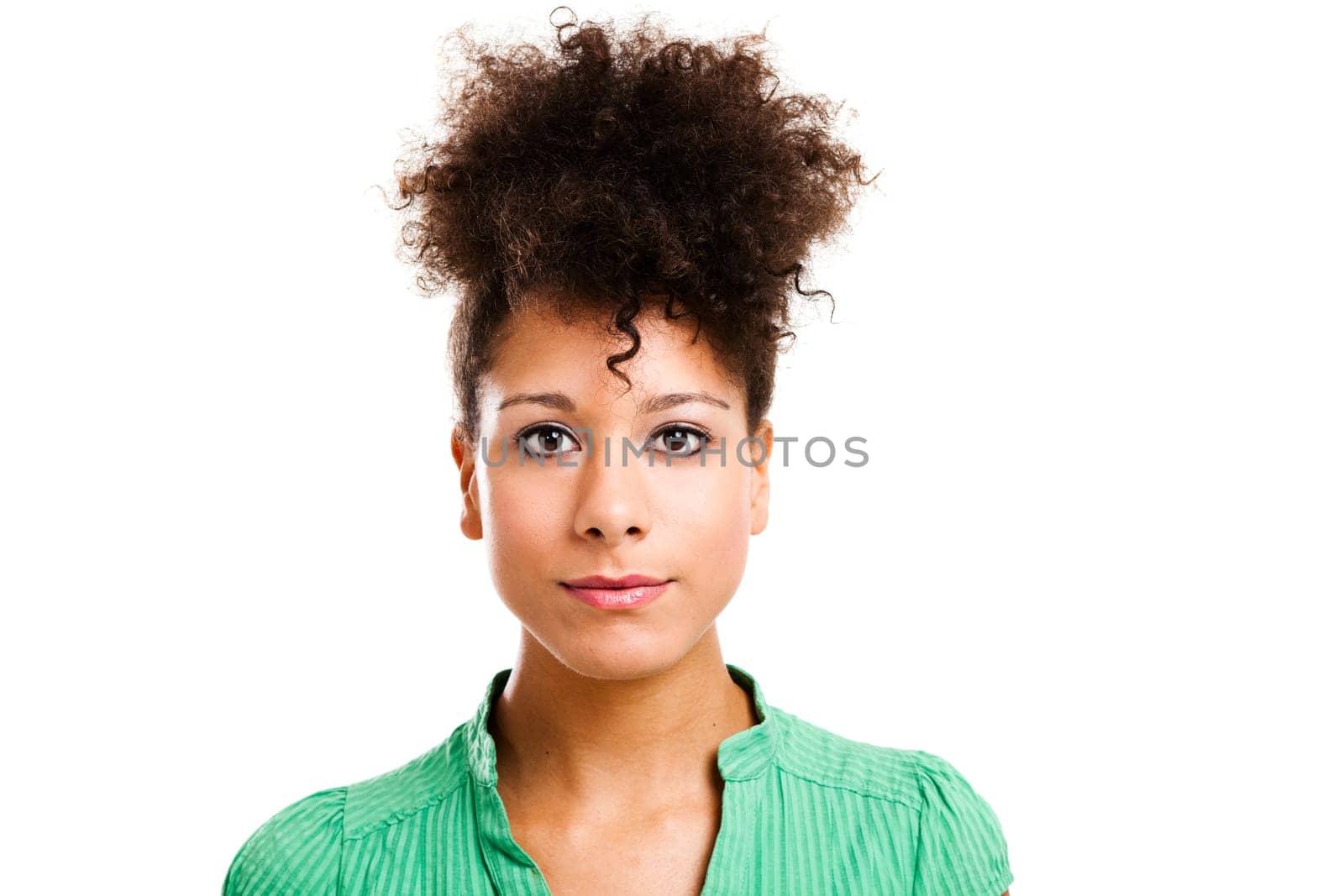 Beautiful woman looking at the camera with a serious face. Studio shot with an isolated white background.