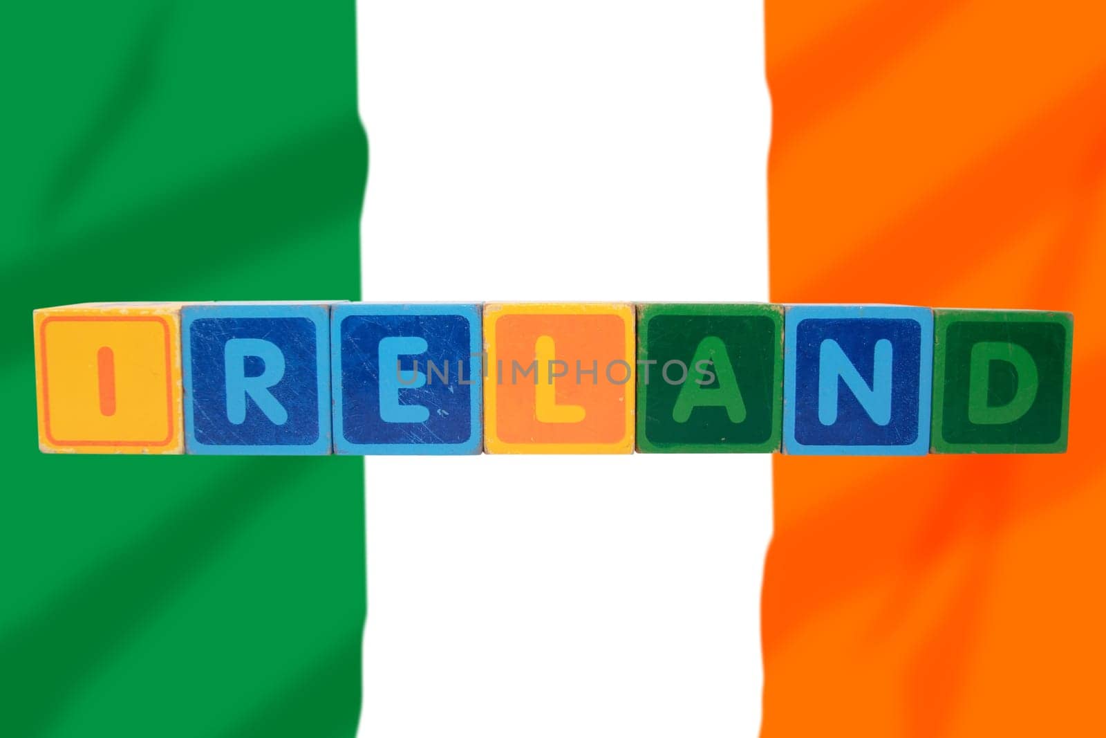 toy letters that spell ireland against a flag background with clipping path