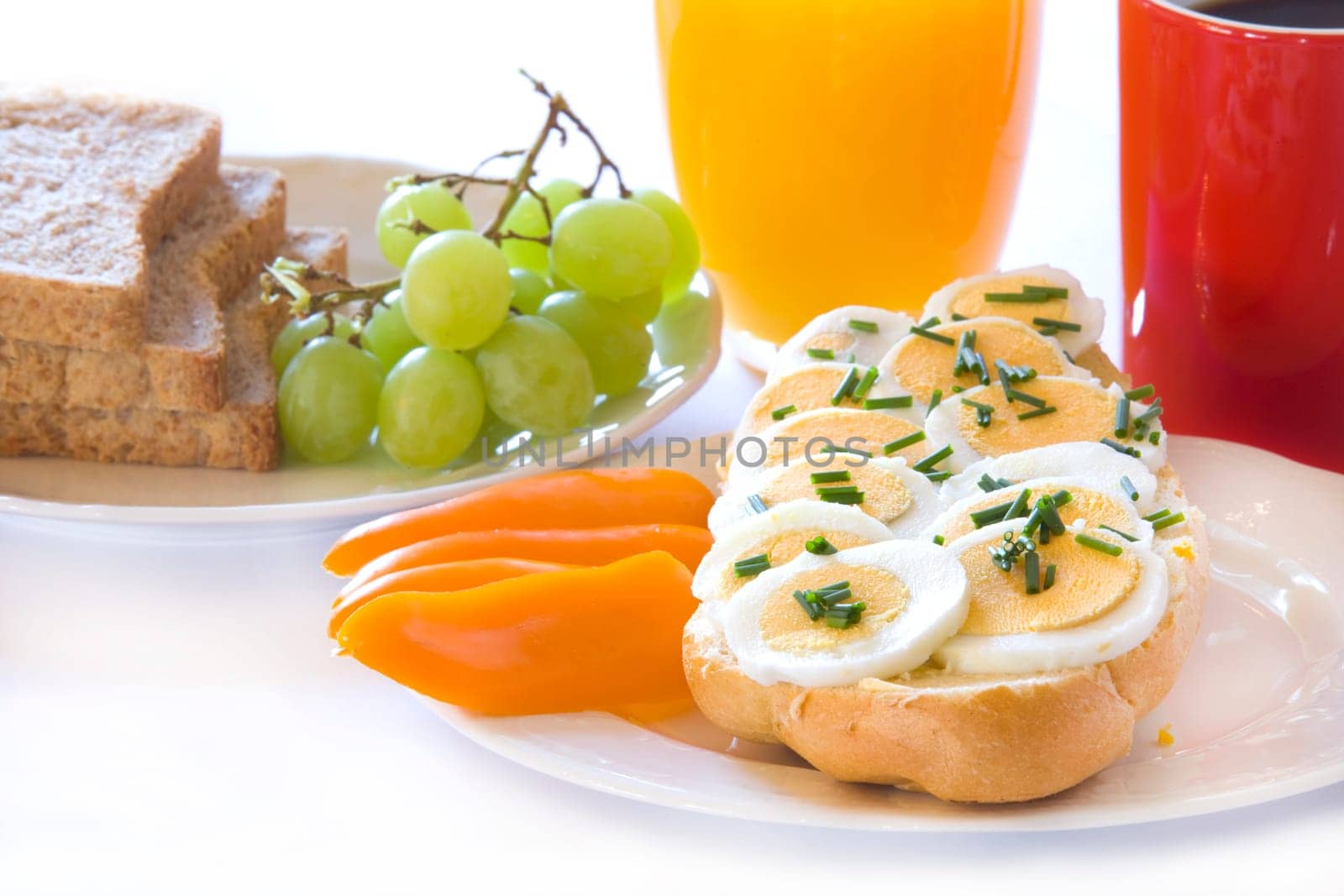Breakfast with egg on bread rolls