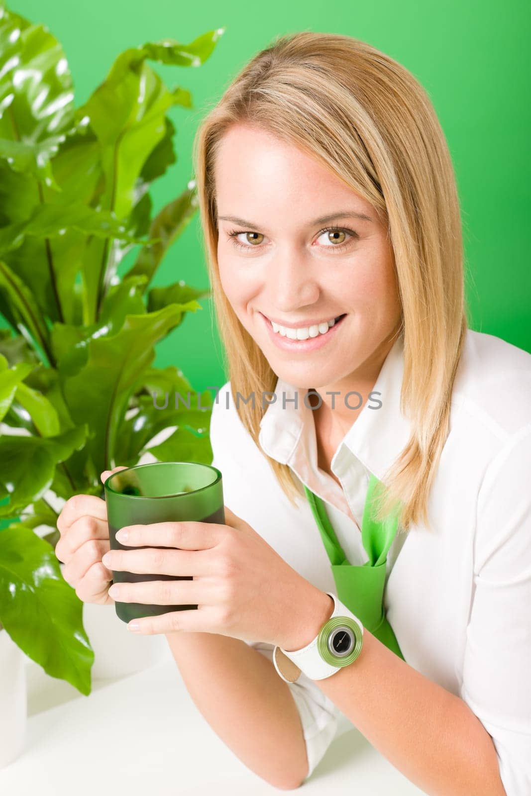 Green business office woman drink coffee plant environment friendly smile