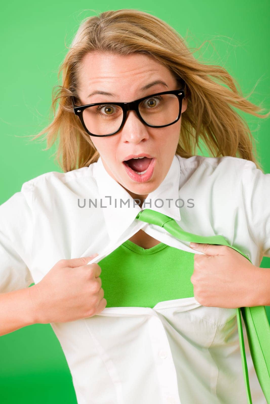 Green Superhero Businesswoman crazy face Emerges from shirt