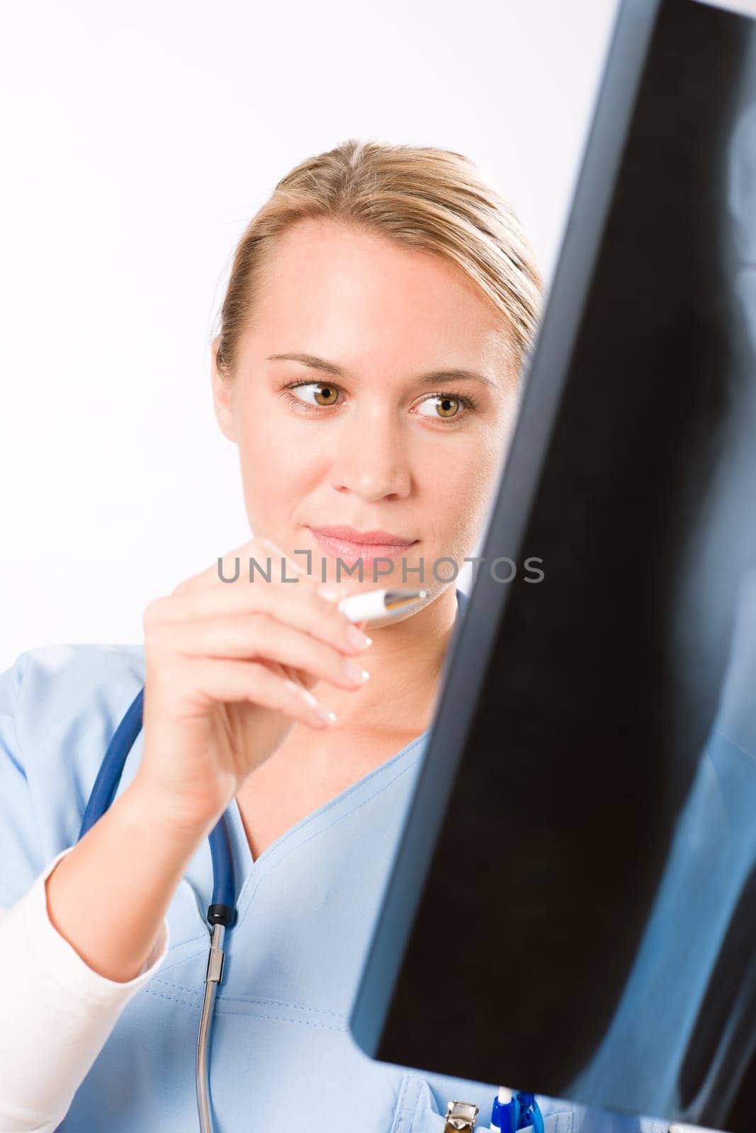 Young female doctor examining x-ray isolated on white background