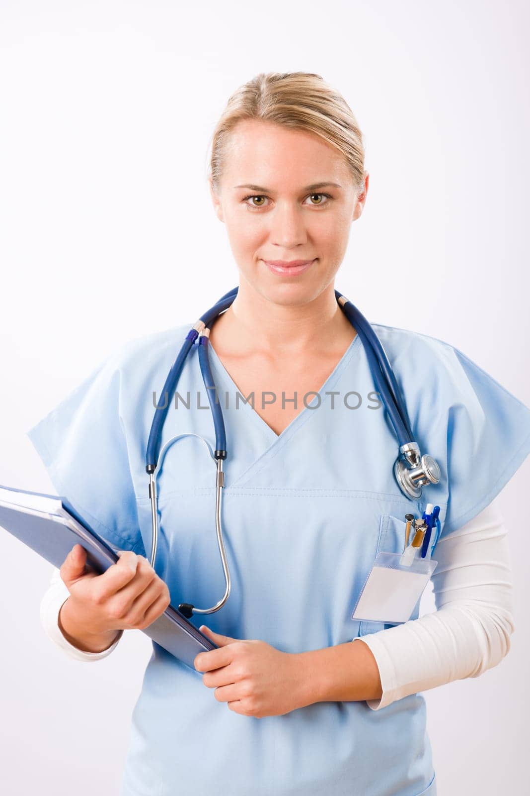 Attractive female doctor standing with stethoscope and folders isolated portrait