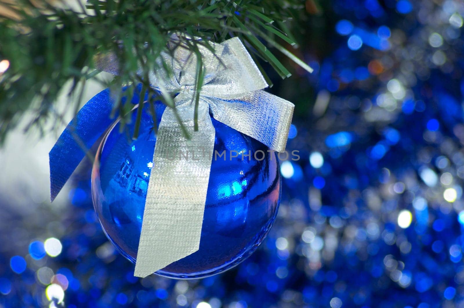 Blue christmas ball with silver ribbon