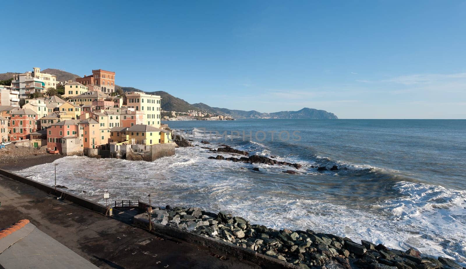 overview of the village of Boccadasse with rough seas