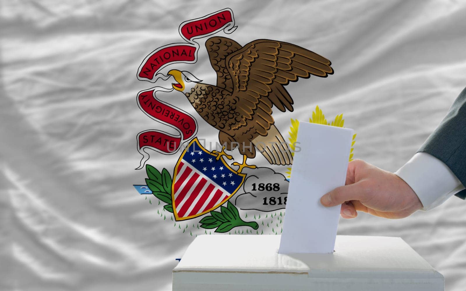 man putting ballot in a box during elections  in front of flag american state of illinois