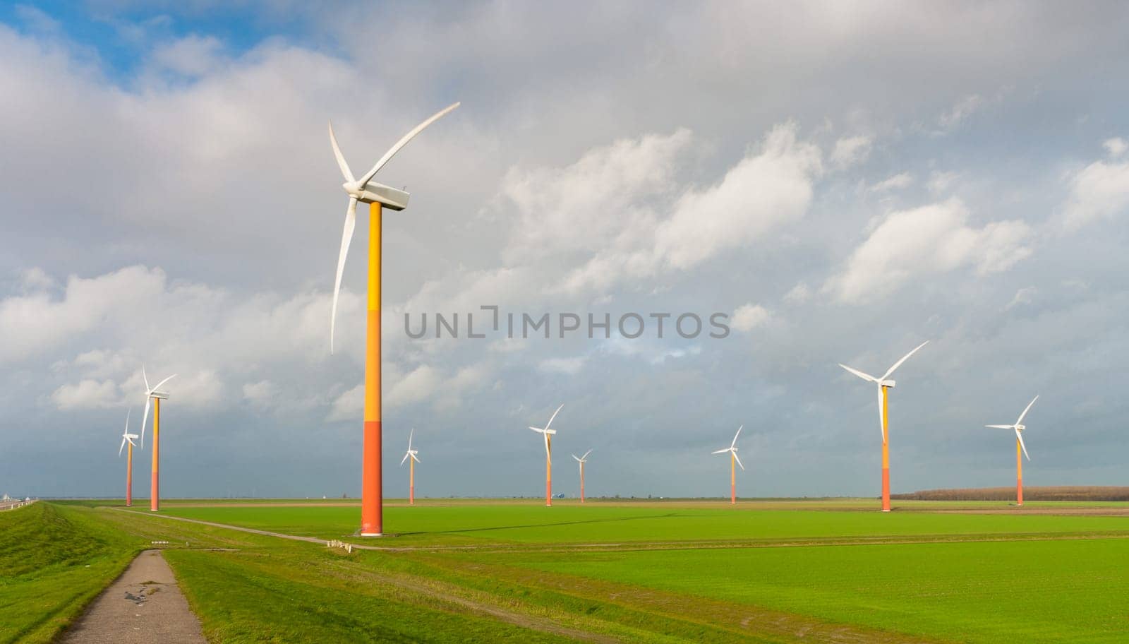 windmill farm with colorful windmills in Almere, netherlands
