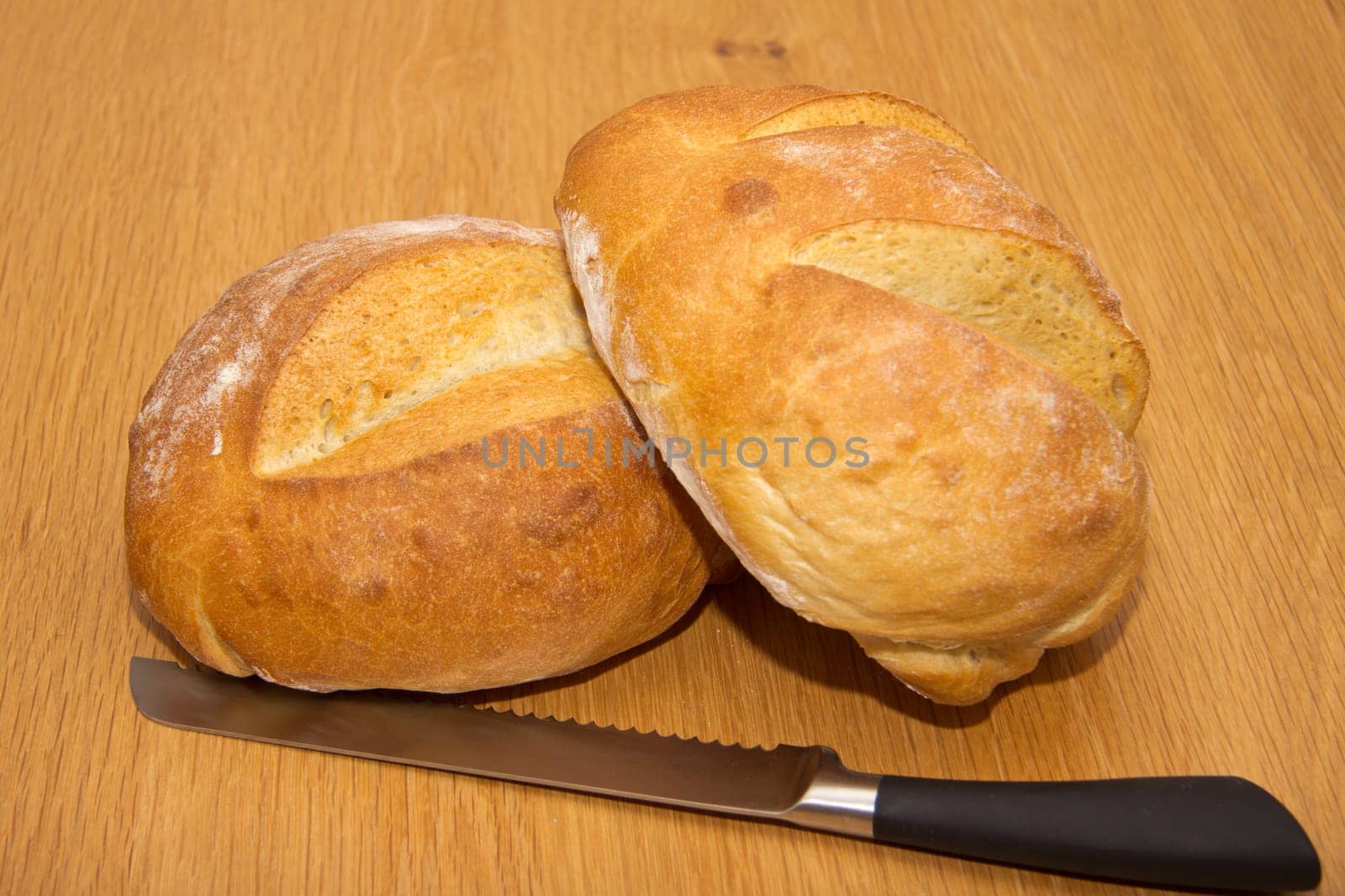 Freshly baked bread and a knife